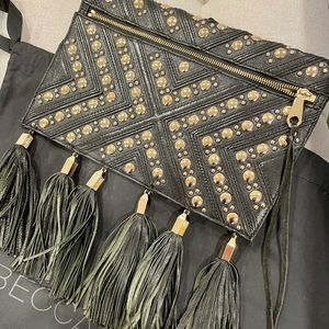 Rebecca Minkoff black and gold studded clutch with tassels. Dust bag included.